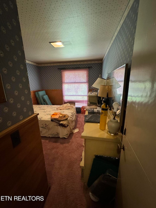 carpeted bedroom with ornamental molding