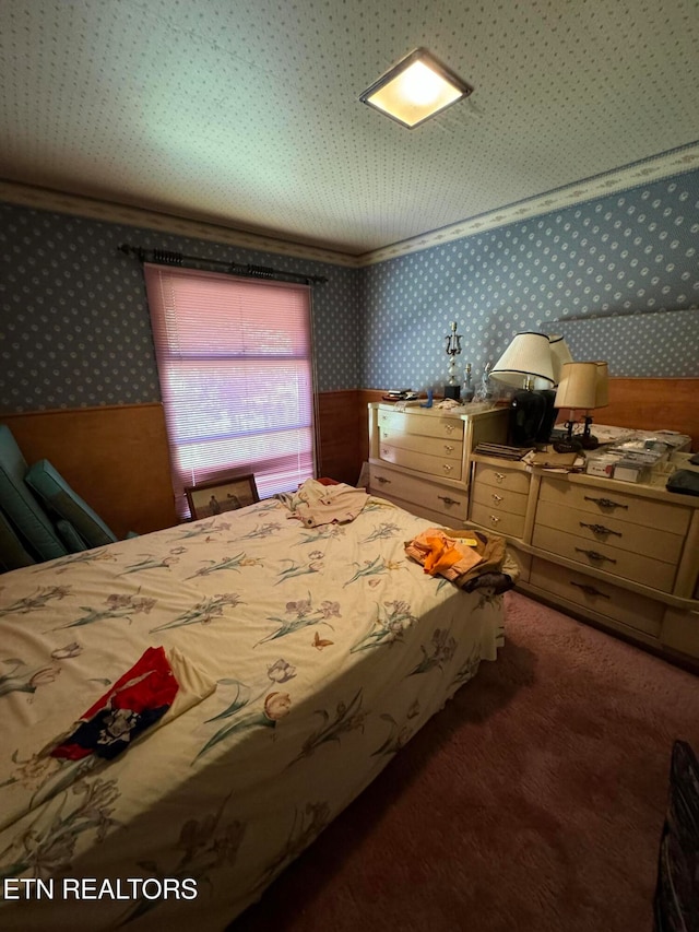 carpeted bedroom featuring crown molding