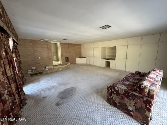 unfurnished living room with carpet