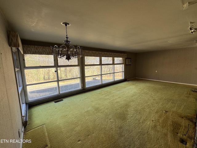 unfurnished dining area with an inviting chandelier, carpet floors, and an AC wall unit