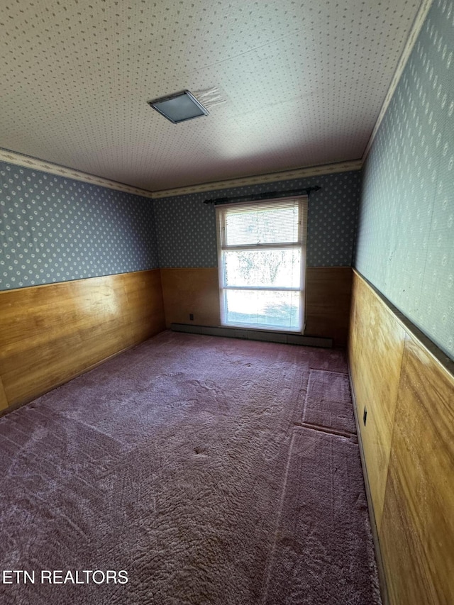 carpeted empty room with crown molding