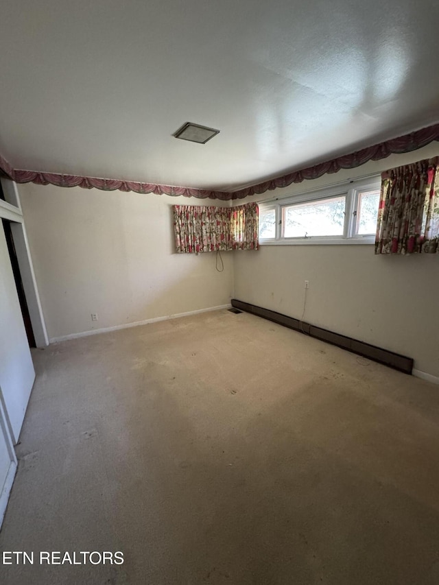 spare room featuring a baseboard heating unit