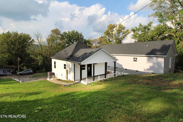 back of house with a yard