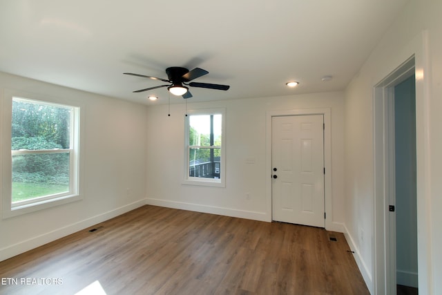 interior space featuring hardwood / wood-style floors, ceiling fan, and a wealth of natural light