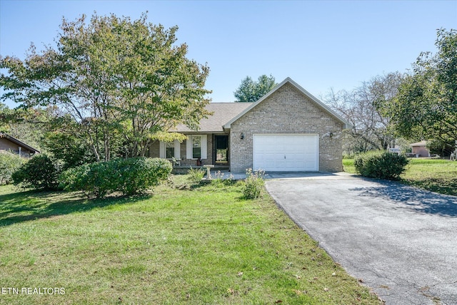 single story home featuring a garage and a front lawn