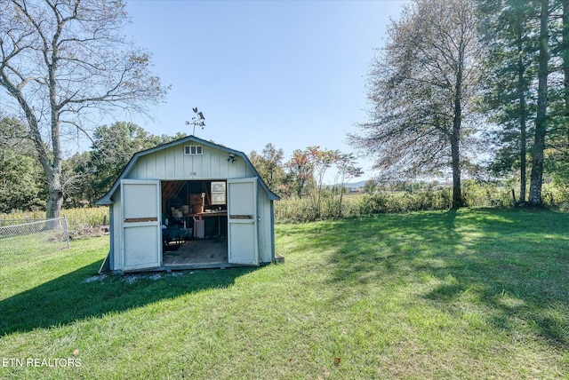 view of outbuilding featuring a lawn