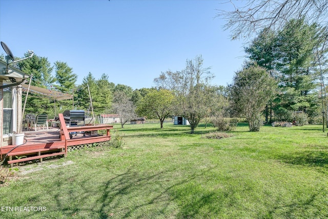 view of yard featuring a pergola and a deck