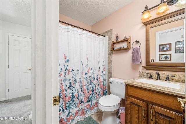 bathroom featuring a textured ceiling, a shower with shower curtain, vanity, and toilet