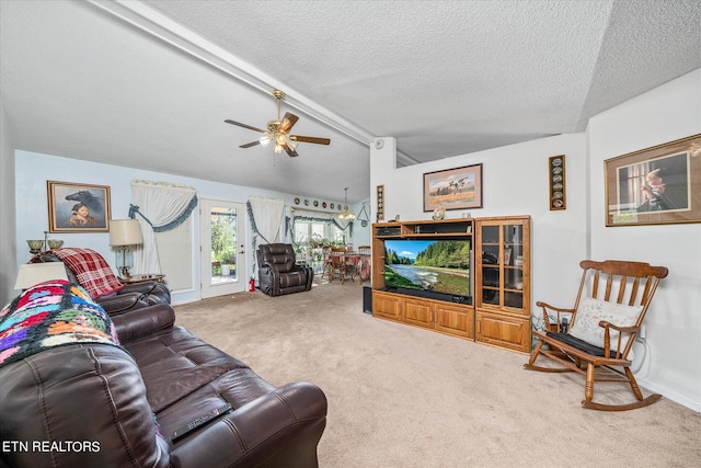 carpeted living room with lofted ceiling, a textured ceiling, and ceiling fan