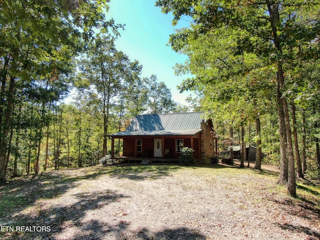 view of log cabin