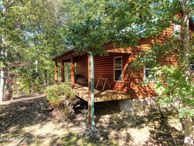 exterior space featuring a wooden deck