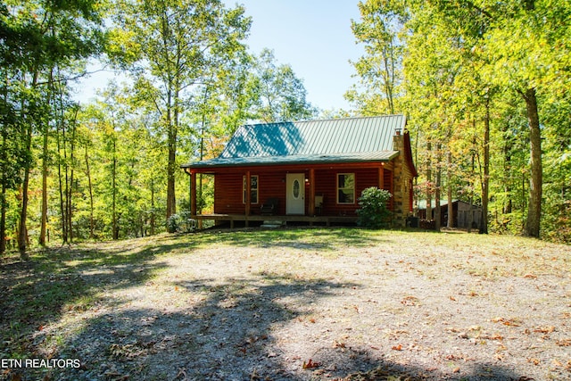 log cabin featuring a porch