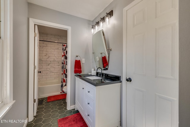 full bathroom with toilet, shower / bath combo with shower curtain, vanity, and tile patterned floors