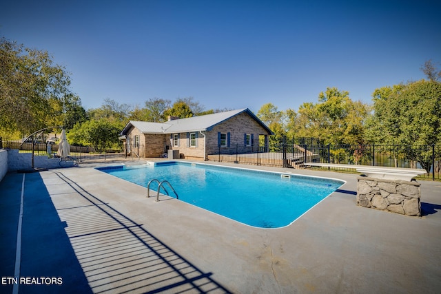 view of pool featuring a patio area