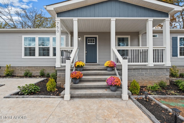 doorway to property with a porch