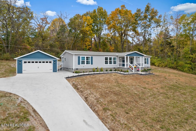 ranch-style house with a garage, an outdoor structure, and a front lawn