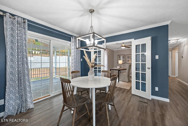 dining room featuring ceiling fan with notable chandelier, ornamental molding, dark hardwood / wood-style floors, and french doors