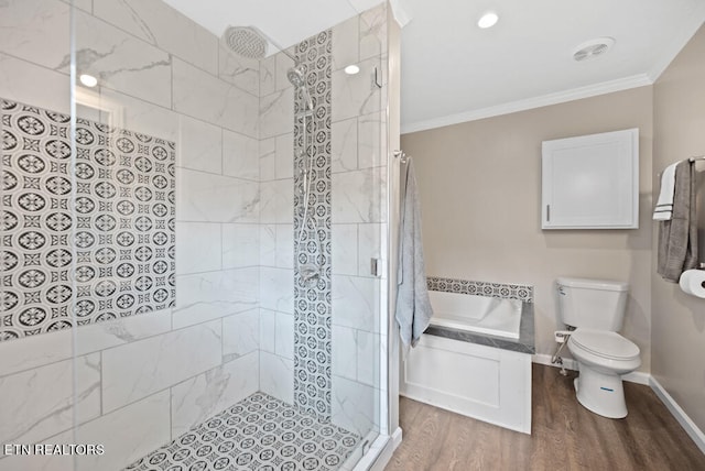 bathroom featuring ornamental molding, hardwood / wood-style flooring, plus walk in shower, and toilet