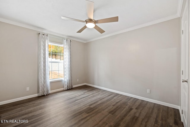 spare room featuring ceiling fan, ornamental molding, and dark wood-type flooring