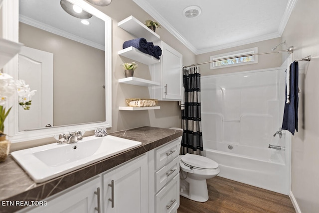 full bathroom featuring vanity, ornamental molding, wood-type flooring, shower / tub combo, and toilet