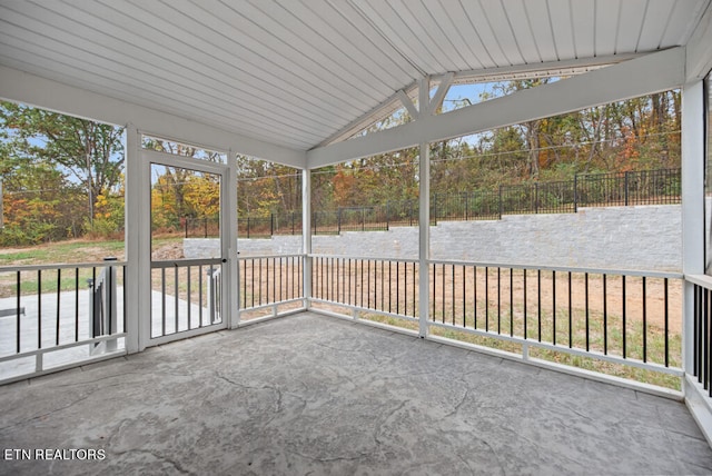 unfurnished sunroom with wooden ceiling and lofted ceiling