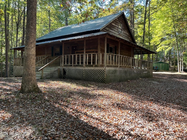 view of side of home with a storage unit