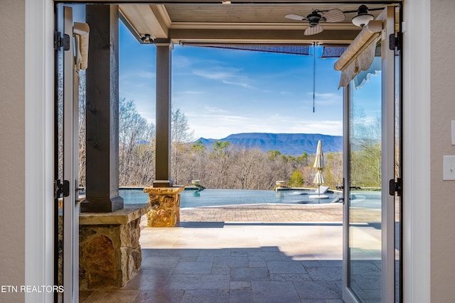 entryway featuring a mountain view and plenty of natural light