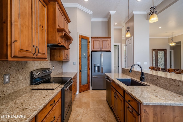 kitchen with stainless steel appliances, light stone counters, hanging light fixtures, and sink