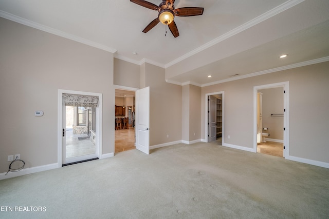 interior space featuring ceiling fan and crown molding