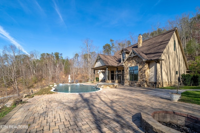 view of swimming pool featuring a patio