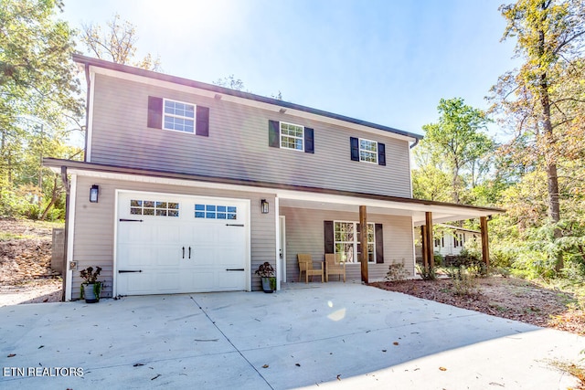 view of front of house with a garage and a porch