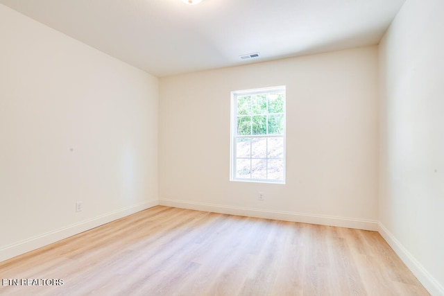 unfurnished room featuring light hardwood / wood-style floors