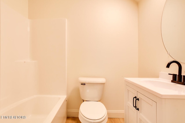 full bathroom with bathtub / shower combination, vanity, toilet, and wood-type flooring