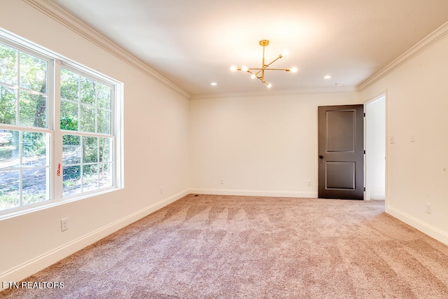 empty room with carpet floors, ornamental molding, and a wealth of natural light