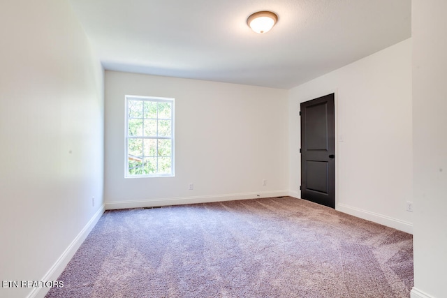 empty room with carpet flooring