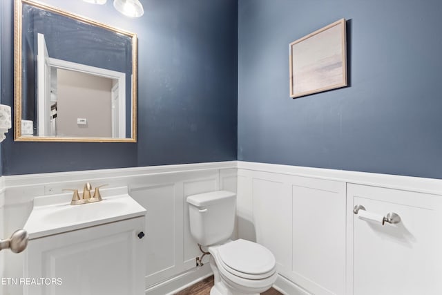 bathroom featuring vanity and toilet