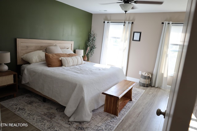 bedroom featuring ceiling fan and light hardwood / wood-style floors