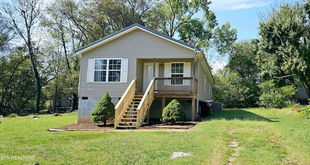 view of front of home featuring central AC and a front yard