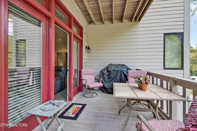deck with outdoor dining area