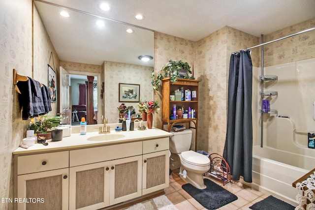 full bathroom featuring shower / bath combo with shower curtain, tile patterned floors, vanity, and toilet