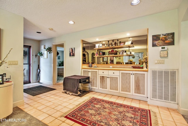 bar featuring light tile patterned floors, recessed lighting, wet bar, and visible vents
