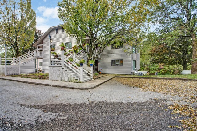 view of front of home with stairs