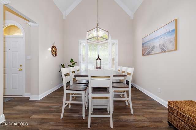 dining space with crown molding, high vaulted ceiling, an inviting chandelier, and dark hardwood / wood-style floors