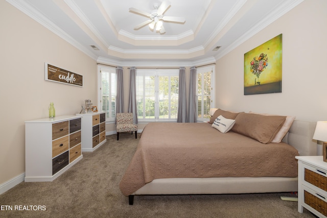 bedroom with ornamental molding, carpet floors, a raised ceiling, and ceiling fan