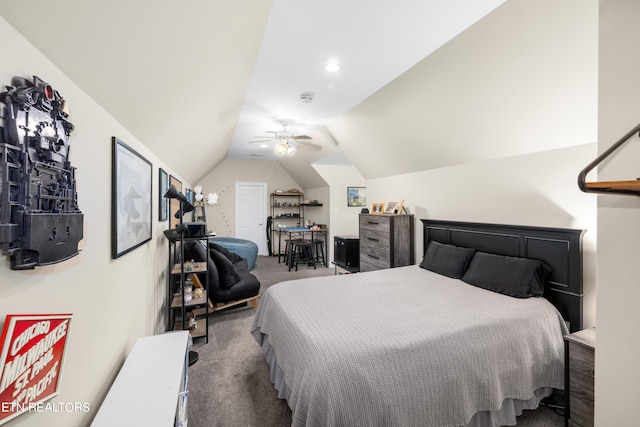 bedroom featuring ceiling fan, vaulted ceiling, and dark carpet