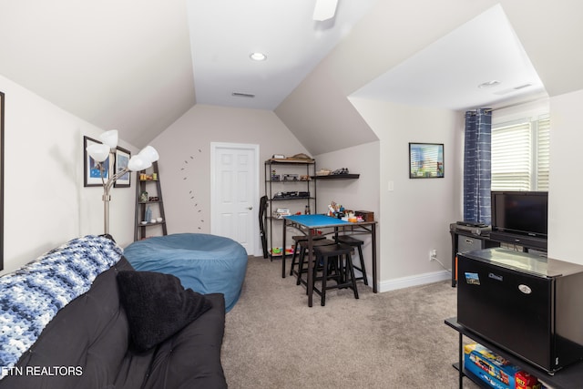 carpeted bedroom featuring lofted ceiling