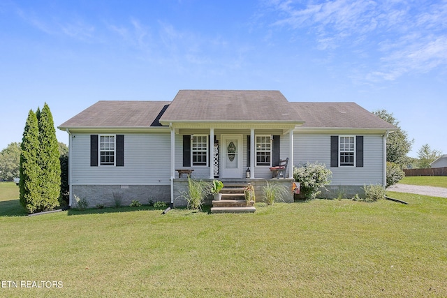 view of front facade featuring a front lawn and covered porch