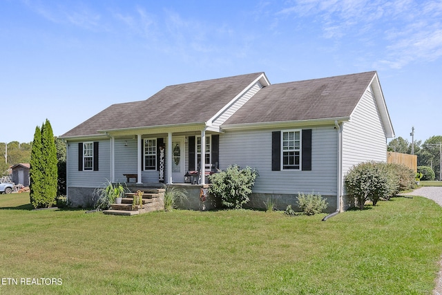 view of front of house featuring a front yard and a porch