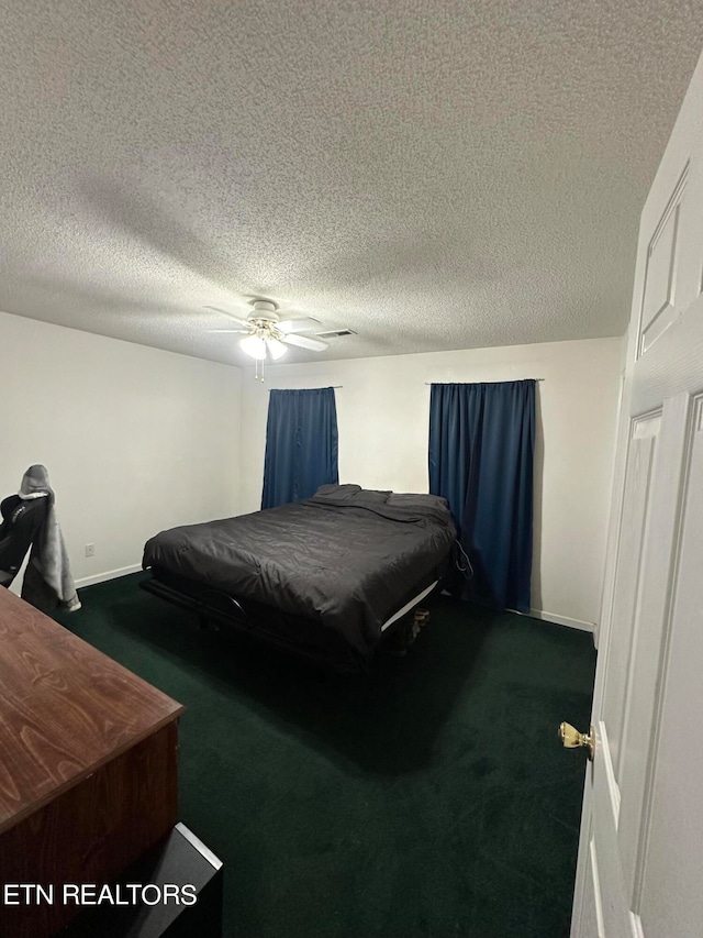 carpeted bedroom with a textured ceiling and ceiling fan