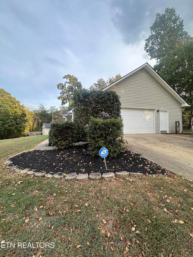 view of side of property with a garage